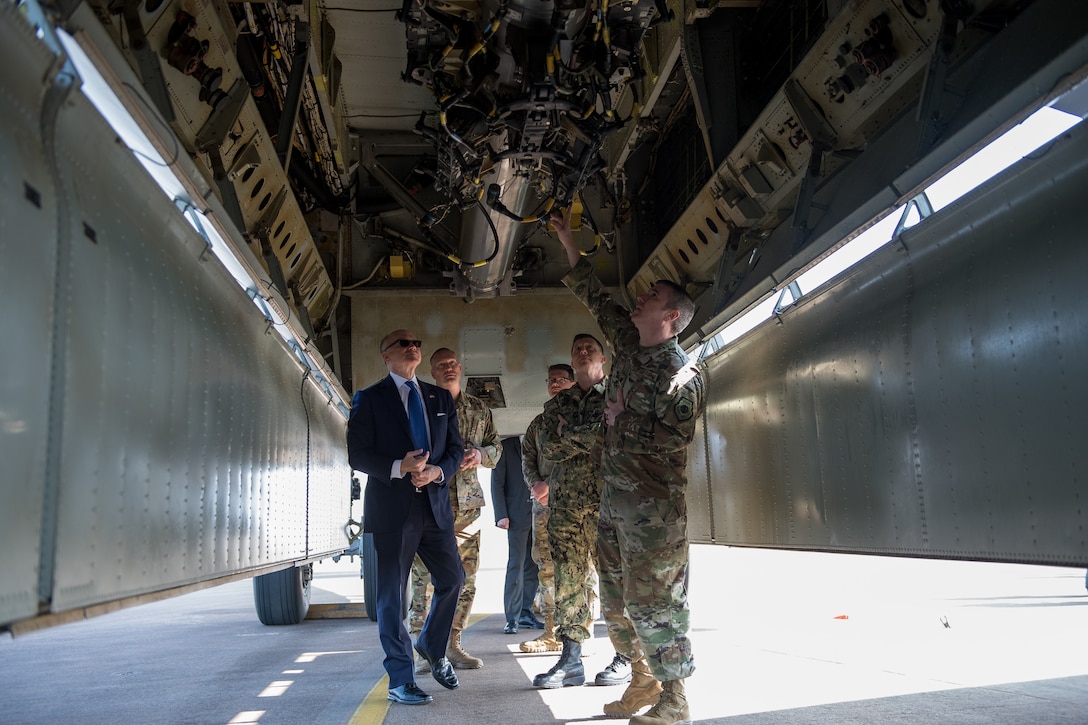U.S. Ambassador to the U.K. Robert Wood Johnson and Rear Adm. David Manero, U.S. European Command Senior Defense Official, receive a tour of a B-52 Stratofortress bomb bay during their visit to RAF Fairford, England, March 29, 2019. The B-52s are at RAF Fairford to support U.S. Strategic Command’s Bomber Task Force in Europe. (U.S. Air Force photo by Airman 1st Class Tessa B. Corrick)