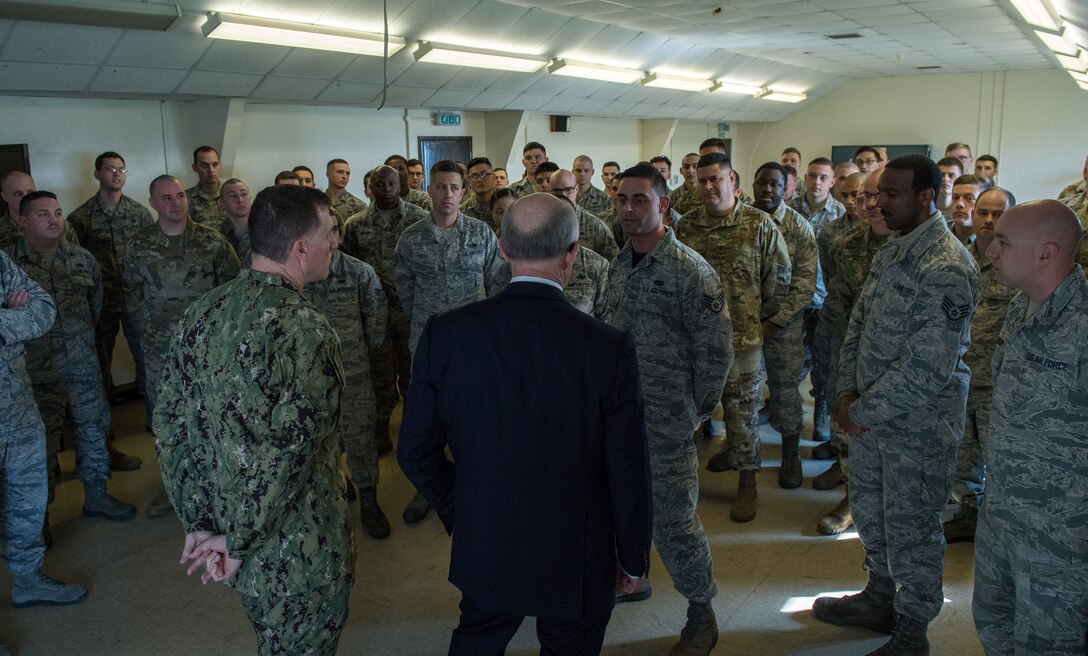 U.S. Ambassador to the U.K. Robert Wood Johnson, speaks with Airmen deployed from Barksdale Air Force Base, La., during a visit to RAF Fairford, England, March 29, 2019. During his time at RAF Fairford, Johnson visited the maintenance building to meet and talk with some of the Airmen that are temporarily working there in support of U.S. Strategic Command’s Bomber Task Force in Europe. (U.S. Air Force photo by Airman 1st Class Tessa B. Corrick)