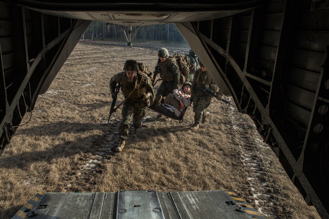 U.S. Marines and Sailors with 8th Engineer Support Battalion, 2nd Marine Logistics Group, evacuate a simulated casualty during a casualty evacuation (CASEVAC) to develop and maintain proficency at Camp Lejeune, North Carolina, Jan. 30, 2019. The Marines and Sailors took part in a CASEVAC drill to train in tactical combat casualty care while integrated with Marine Heavy Helicopter Squadron 461. (U.S. Marine Corps photo by Lance Cpl. Damion Hatch Jr.)