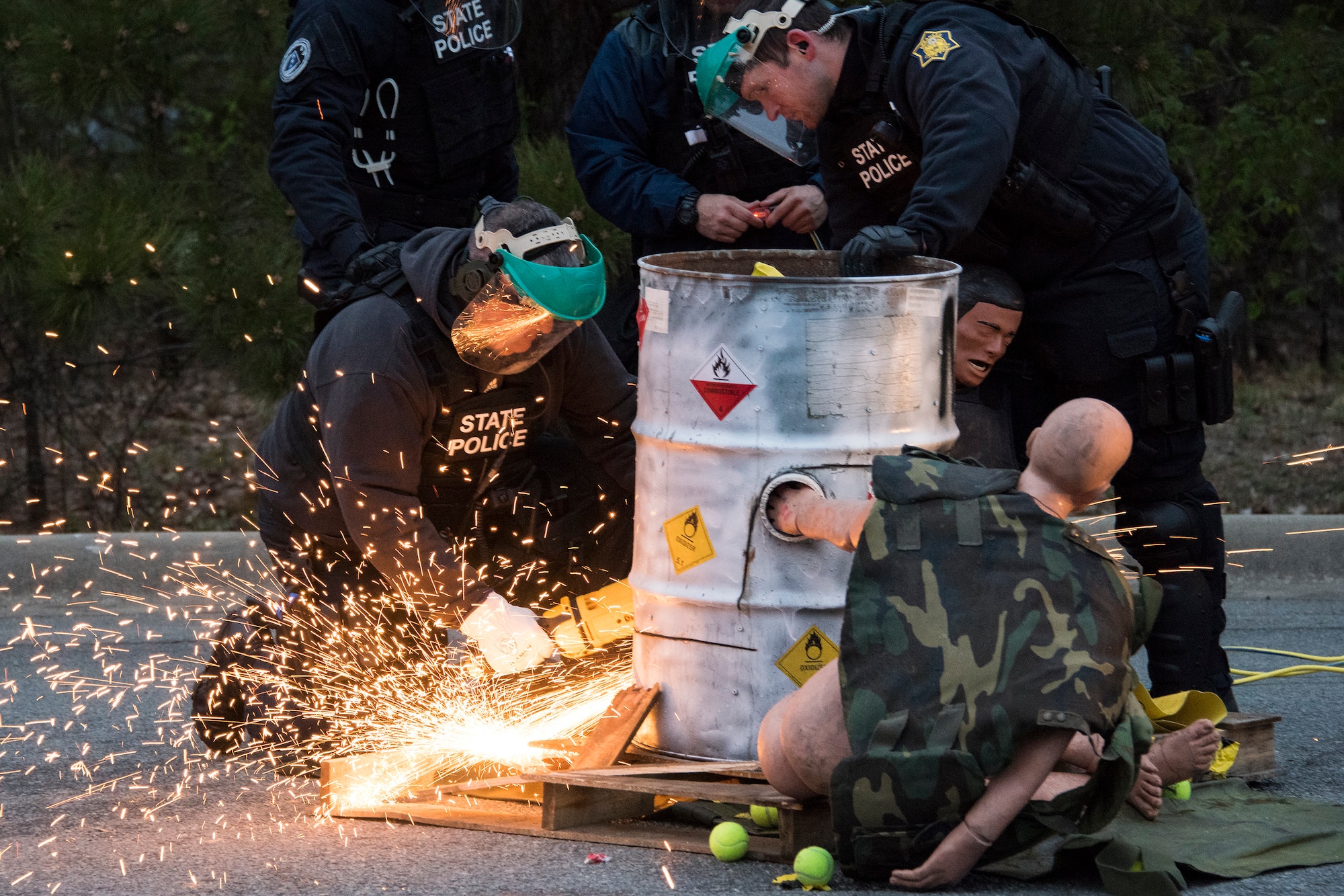 Arkansas State Police officers practice cutting open a “sleeping dragon” barrel to remove protesters during Operation Phalanx, held March 30-31, 2019, at Little Rock AFB, Arkansas. The operation is a joint exercise hosted by the Arkansas National Guard for civil and military organizations to train their members’ tactics and techniques for responding to a civil disturbance. (U.S. Air National Guard photo by Tech. Sgt. John E. Hillier)