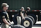 U.S. Army Soldiers assigned to the 368th Seaport Operations Company, 11th Transportation Battalion, 7th Trans. Brigade (Expeditionary), steady the tires for the Soldiers competing for the fastest tire change at Joint Expeditionary Base Little Creek-Fort Story, Virginia, March 29, 2019. The Soldiers from the company are tasked with judging the truck rodeo competition since they were the creators of the concept. (U.S. Army photo by Spc. Travis Teate)