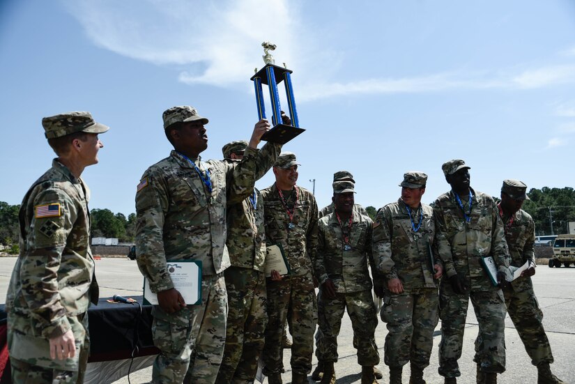 U.S. Army Soldiers assigned to the 11th Transportation Battalion, 7th Trans. Brigade (Expeditionary), took the trophy for the 2019 7th Trans. Bde. (Ex.) Truck Rodeo at Joint Expeditionary Base Little Creek-Fort Story, Virginia, March 29, 2019. Teams competed for two days at the unit level before a senior noncommissioned officer from each battalion organized their own All-Star team to compete in the brigade-wide competition. (U.S. Army photo by Spc. Travis Teate)