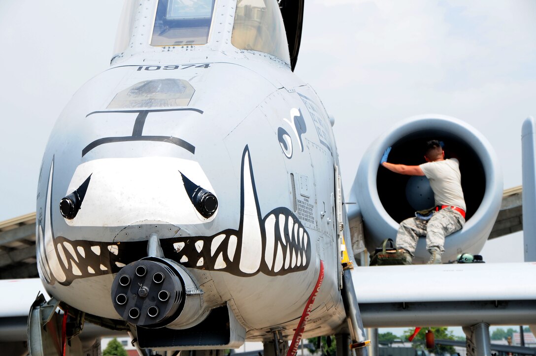 Airman First Class Jerry Olivan, 924th Aircraft Maintenance Squadron crew chief, checks the inlets and exhausts of an A-10 Thunderbolt II as part of a thru-flight inspection at Selfridge Air National Guard Base, Mich., during the 924th FG annual tour, July 24, 2018. This inspection takes place when an aircraft lands and will be flown again the same day. (U.S. Air Force Photo/Tech. Sgt. Courtney Richardson/RELEASED)