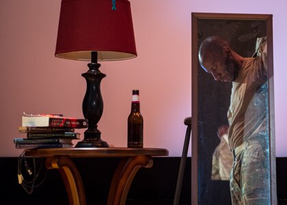 U.S. Air Force Staff Sgt. Patrick Sims, 733rd Logistics Readiness Squadron vehicle mechanic, takes the top of his uniform off while rehearsing the play ‘Everybody Knows’ at Joint Base Langley-Eustis, Virginia, April 9, 2019.