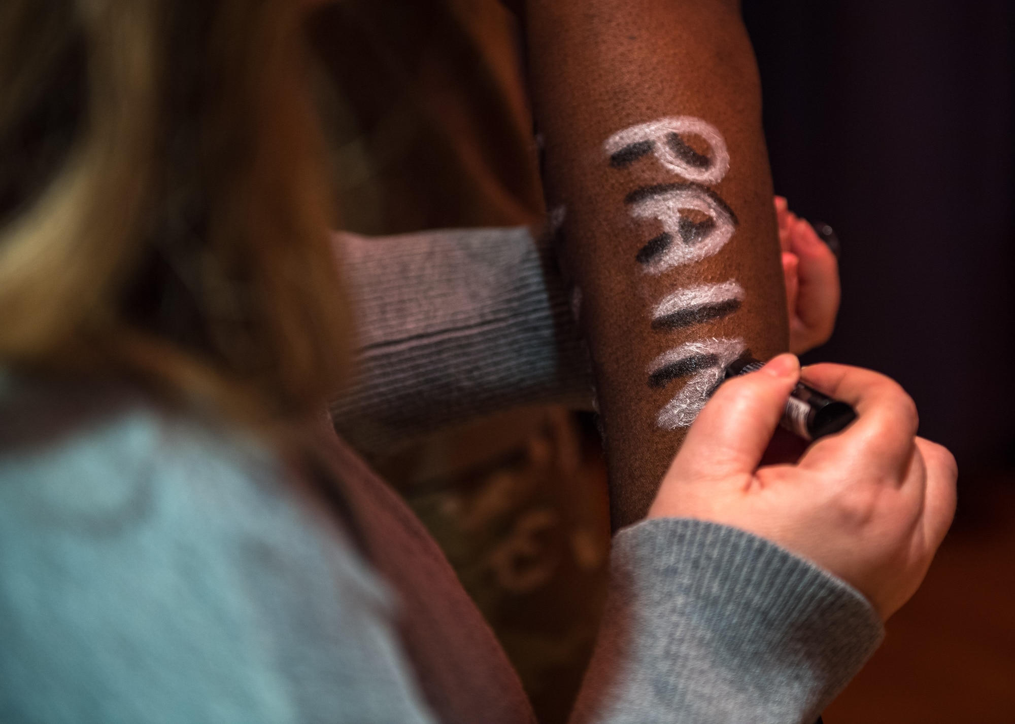 The Sexual Assault Theater Group displays negative emotions written on a simulated sexual assault victim while rehearsing the play ‘Everybody Knows’ at Joint Base Langley-Eustis, Virginia, April 9, 2019.
