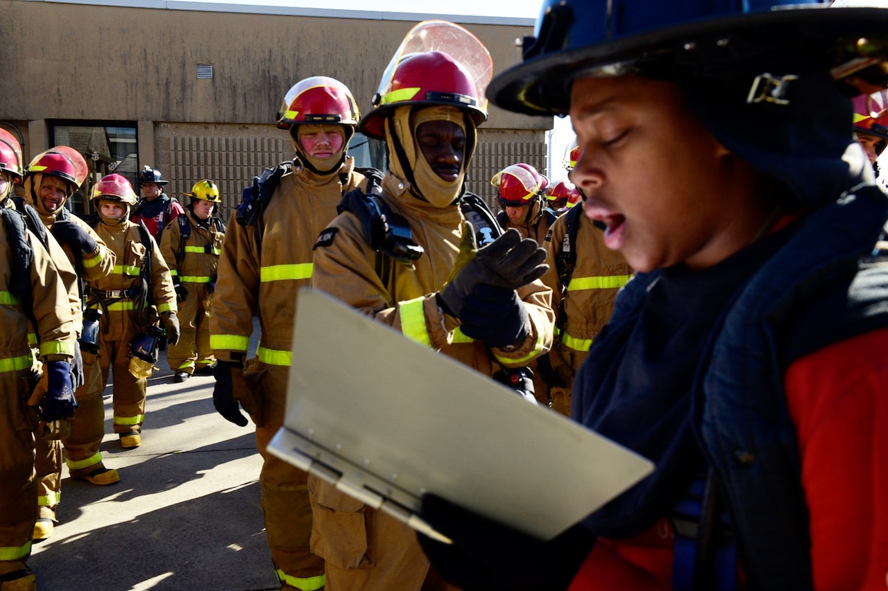 Sailor takes attendance at firefighting school.