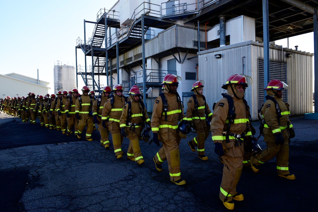 Sailors march to firefighting training.