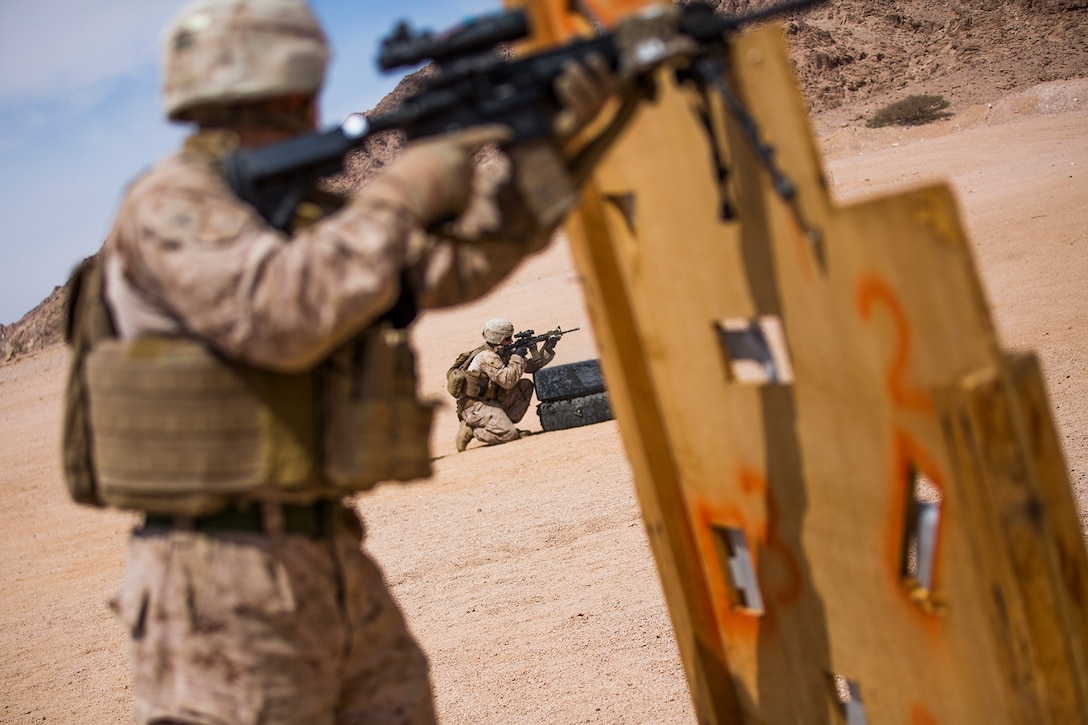 Marines conduct a fire team assault course.