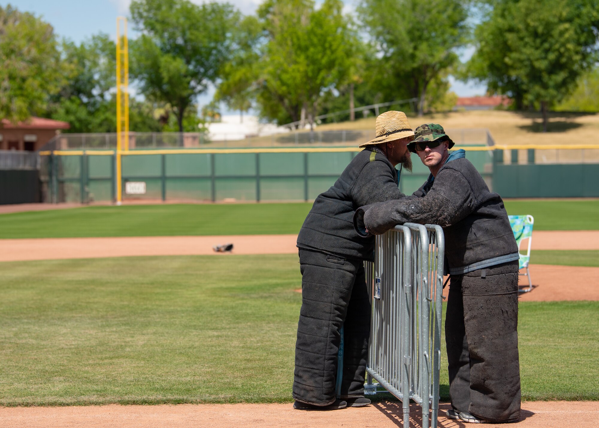 Police officers take a break during the 2019 Desert Dog Trials, as they wait for the next participant enter the field, April, 6, at Scottsdale Stadium, Scottsdale, Ariz.