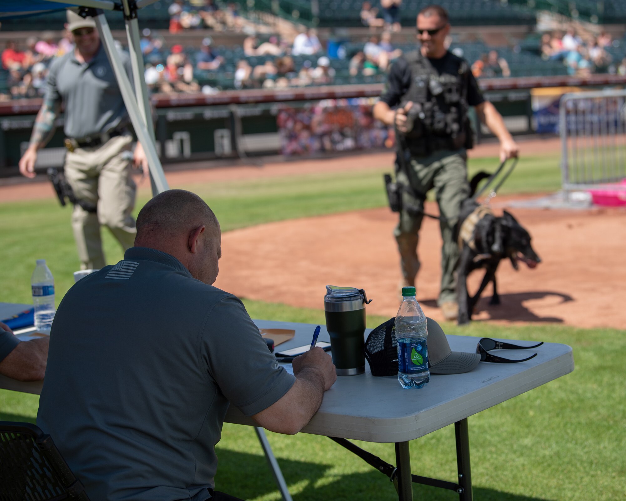 A panel of judges totals up a team’s points after their run at the 2019 Desert Dog Trials, April 6, at Scottsdale Stadium, Scottsdale, Ariz.