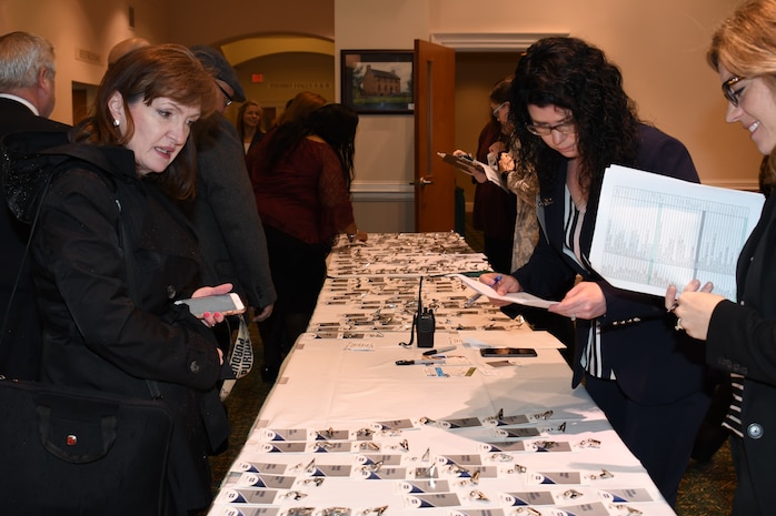 IMAGE: NSWCDD employees help attendees check-in at the 2019 NSWC Industry Fair held at the Fredericksburg Expo and Conference Center, March 21.