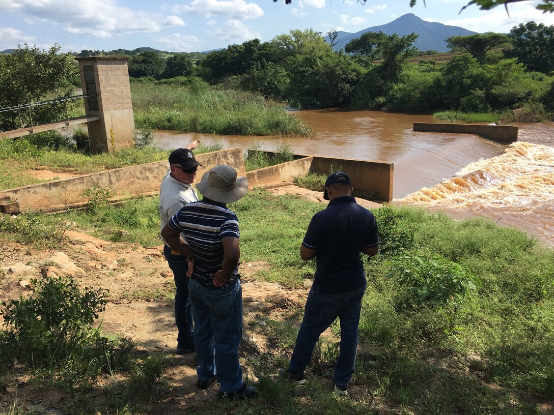 Steve England and Jake Helminiak of the USACE Philadelphia District traveled to the Kingdom of Eswatini (formerly Swaziland) to participate in workshops, field visits, and to share their expertise with government officials. During the visit, the group met with hydrologists and field technicians from the Department of Water Affairs. They visited multiple dams, gaging stations, and a local agricultural water impoundment.