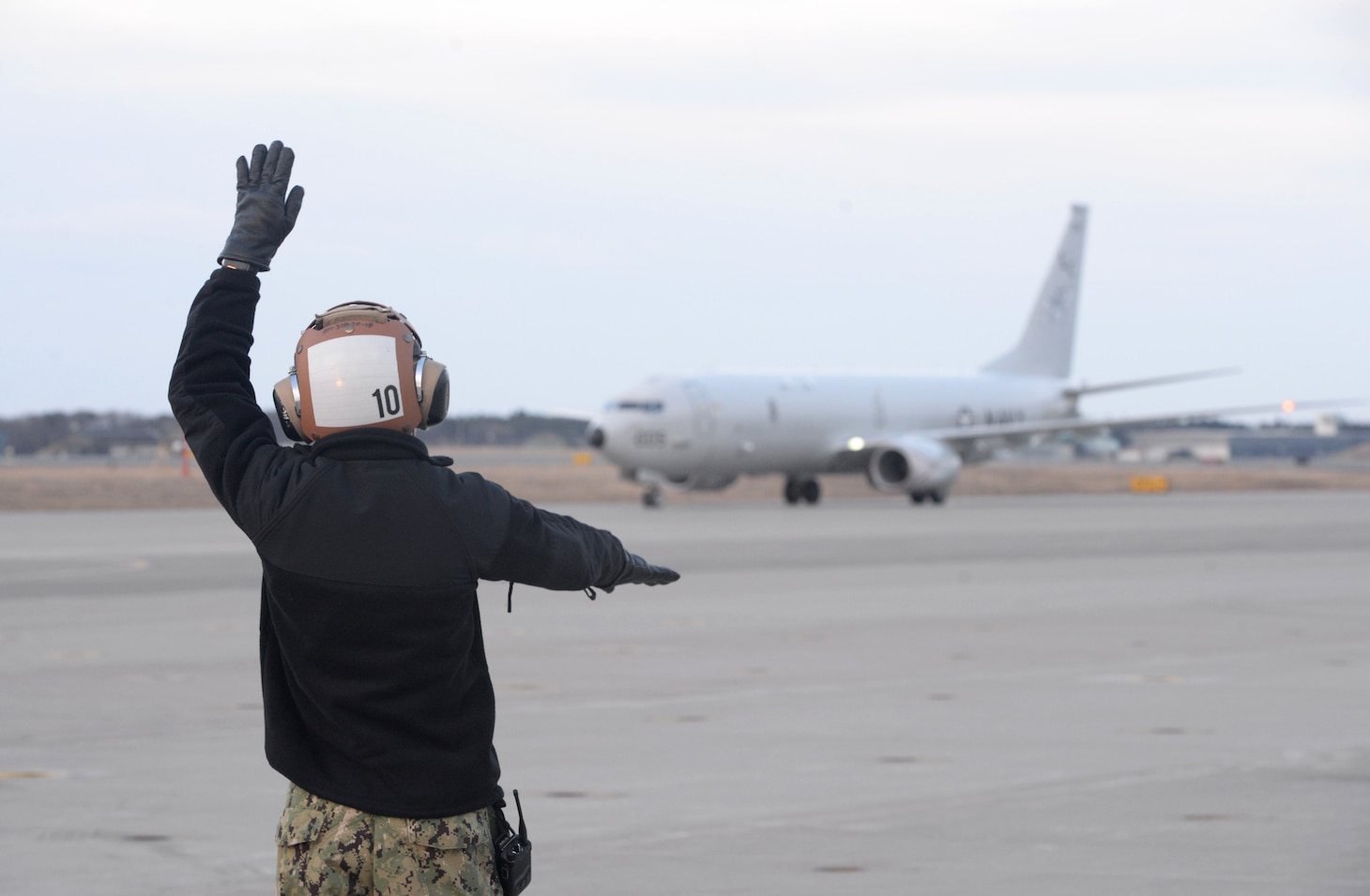 MISAWA, Japan (April 10, 2019) Aviation Maintenance Administrationman Airman Roy Vega directs a P-8A Poseidon aircraft assigned to the “Fighting Tigers” of Patrol Squadron (VP) 8, on the flight line of Misawa Air Base after a Search and Rescue mission for a missing Japanese F-35 fighter jet Pilot. VP-8 is deployed to the U.S. 7th Fleet (C7F) area of operations conducting maritime patrol and reconnaissance operations in support of Commander, Task Force 72, C7F, and U.S. Pacific Command objectives throughout the Indo-Asia Pacific region.