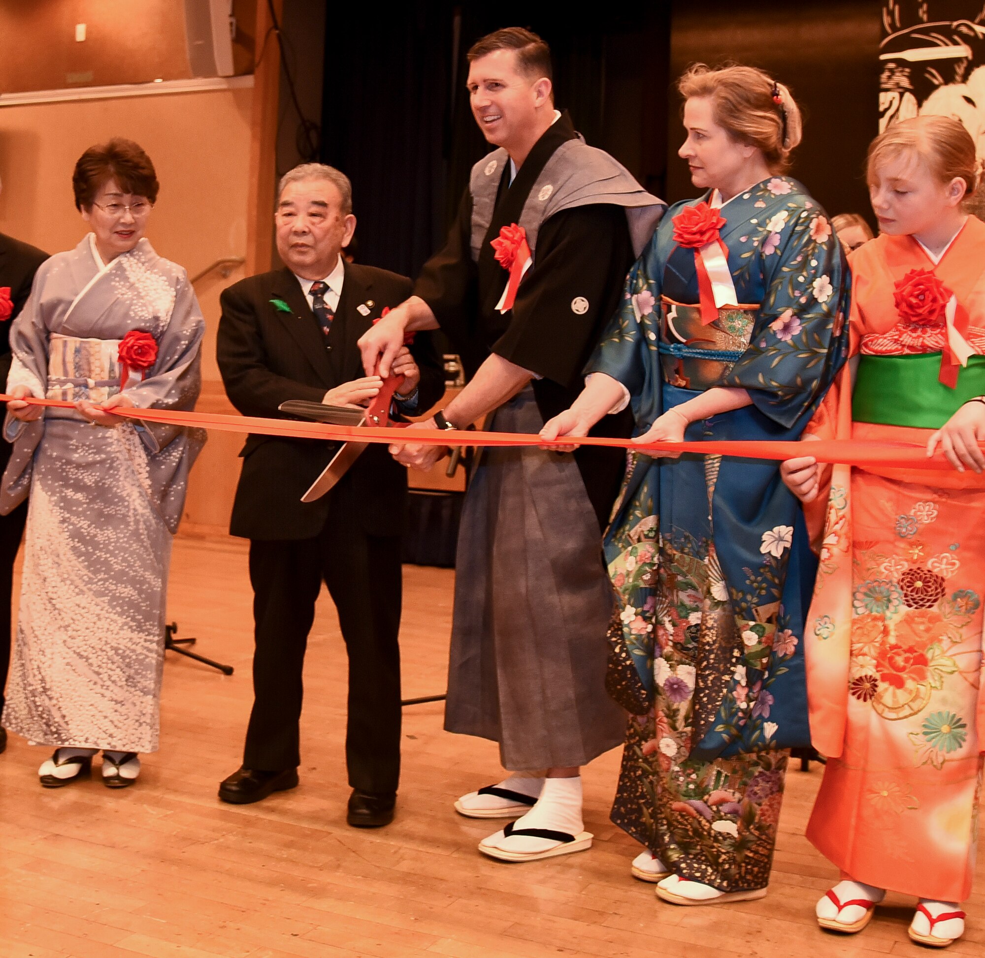 Kazumasa Taneichi, center left, the Misawa City mayor, and U.S. Air Force Col. Jason J. Cockrum, center right, the 35th Operations Group commander, cut the ribbon marking the beginning of the 32nd Annual Japan Day at Misawa Air Base, Japan, April 6, 2019. The Misawa International Club and Misawa AB leadership held their first Japan Day in 1988 to strengthen the community and share Japanese heritage. Conducting annual bilateral events reinforces the more than 60-year relationship that helps preserve peace and stability across the Indo-Pacific region. (U.S. Air Force photo by Branden Yamada)