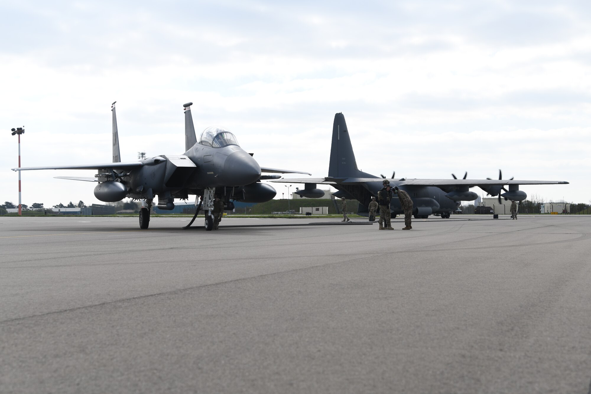 Airmen assigned to the 352nd Special Operations Wing perform Forward Arming and Refueling Point operations with an F-15E Strike Eagle assigned to 48th Fighter Wing April 10, 2019 at Royal Air Force Mildenhall, England. The FARP program is a United States Special Operations Command capability that allows the execution of refueling operations in situations where the use of conventional fueling stations or air-to-air refueling is unavailable. (U.S. Air Force photo/ Airman 1st Class Shanice Williams-Jones)