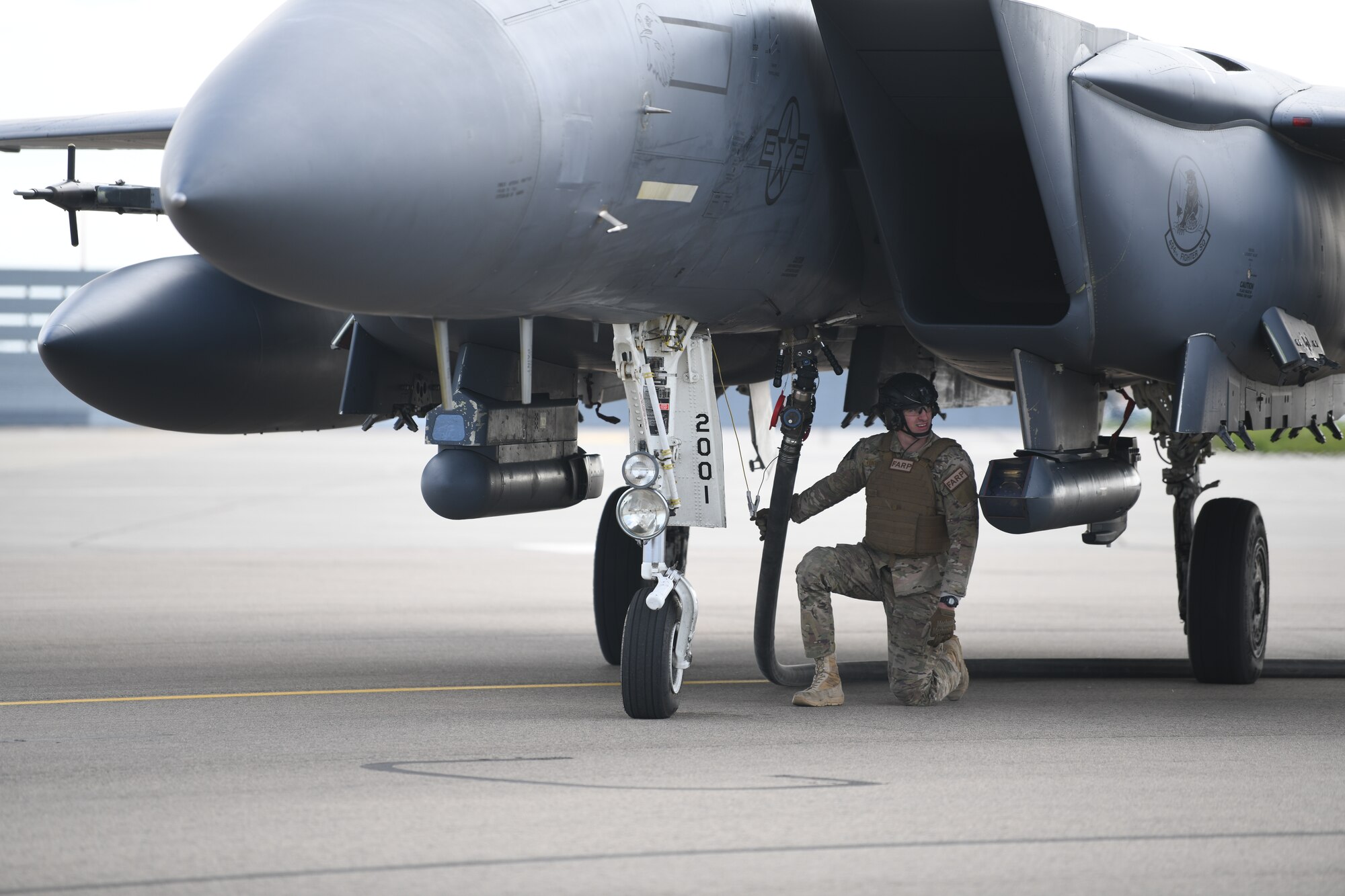 Airmen assigned to the 352nd Special Operations Wing perform Forward Arming and Refueling Point operations with an F-15E Strike Eagle assigned to 48th Fighter Wing April 10, 2019 at Royal Air Force Mildenhall, England. The FARP program is a United States Special Operations Command capability that allows the execution of refueling operations in situations where the use of conventional fueling stations or air-to-air refueling is unavailable. (U.S. Air Force photo/ Airman 1st Class Shanice Williams-Jones)