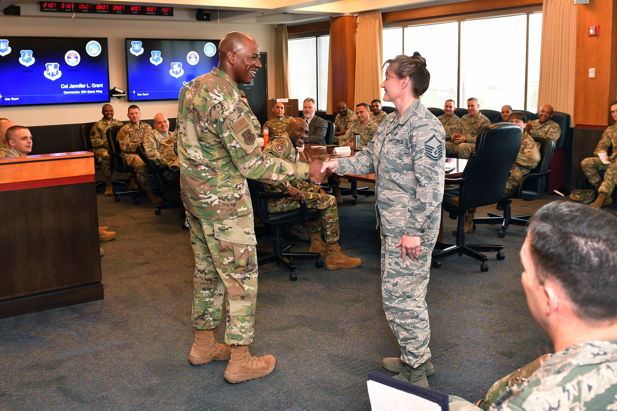 Chief Master Sgt. of the Air Force Kaleth O. Wright recognizes Master Sgt. Kathy Blake, 50th Wing Staff Agency and 50th Comptroller Squadron superintendent, during the wing mission brief at Schriever Air Force Base, Colorado, April 9, 2019. Wright recognized Blake for her support to him at a previous assignment and her continued focus to take care of Airmen.   (U.S. Air Force photo by Dennis Rogers)