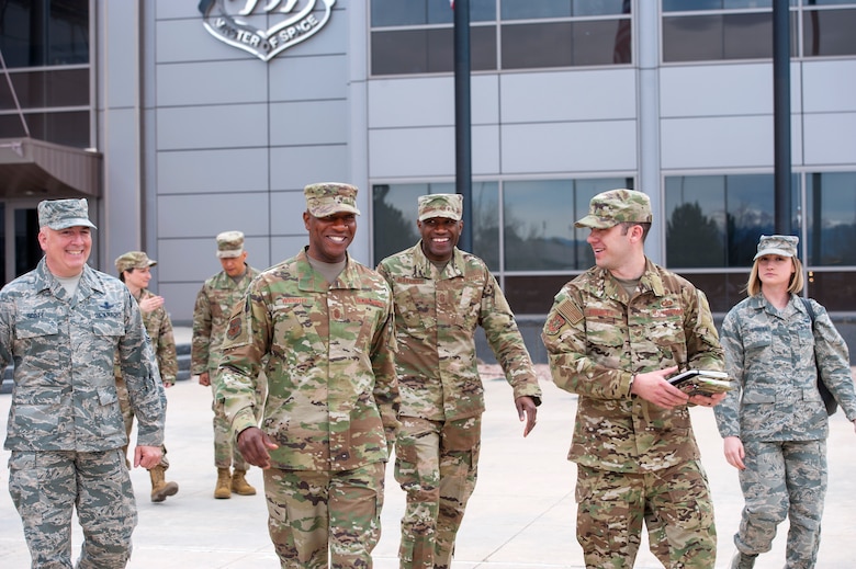 Chief Master Sgt. of the Air Force Kaleth O. Wright walks with wing leadership and staff during his first visit to Schriever Air Force Base, Colorado, April 9, 2019. During Wright’s visit, he engaged with Airmen throughout the wing, to see firsthand how they are evolving space and cyberspace warfighting superiority. (U.S. Air Force photo by Dennis Rogers)