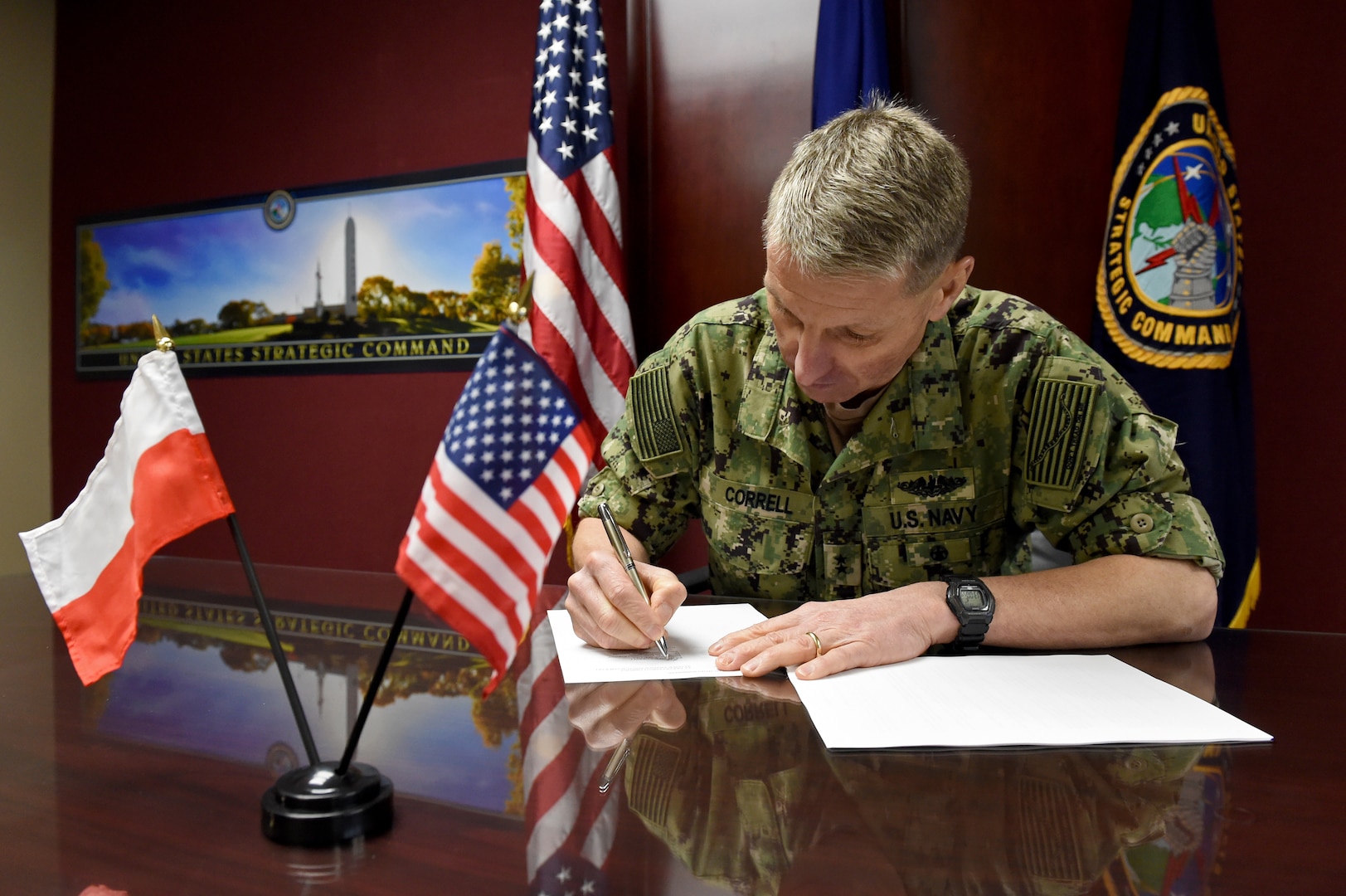U.S. Navy Rear Adm. Richard Correll, U.S. Strategic Command (USSTRATCOM) director of plans and policy, signs an agreement to share space situational awareness (SSA) services and information with the Polish Space Agency at USSTRATCOM headquarters on Offutt Air Force Base, Neb., April 4, 2019. Correll signed the agreement as part of a larger effort to support spaceflight planning and enhance the safety, stability and sustainability of space operations. Poland joins 18 nations, two intergovernmental organizations, and 77 commercial satellite owners, operators, launchers already participating in SSA data-sharing agreements with USSTRATCOM.