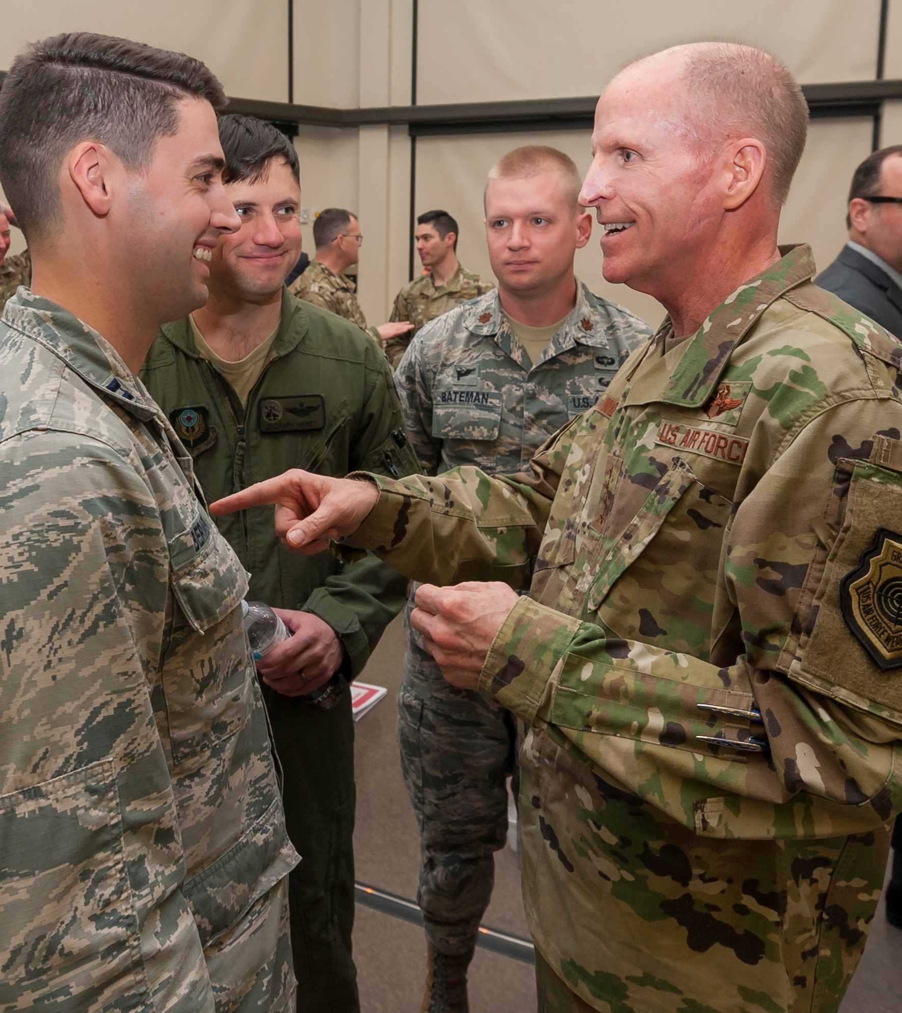 Air Force Vice Chief of Staff Gen. Steven W. Wilson talks with Mission Area Working Group chairs (from left) Capt. Stephen Bernero, Maj. Zachary Haney and Maj. Justin Bateman at the conclusion of the AFIMSC Installation and Mission Support Weapons and Tactics Conference April 10 at Joint Base San Antonio-Lackland. (U.S. Air Force photo by Malcolm McClendon)