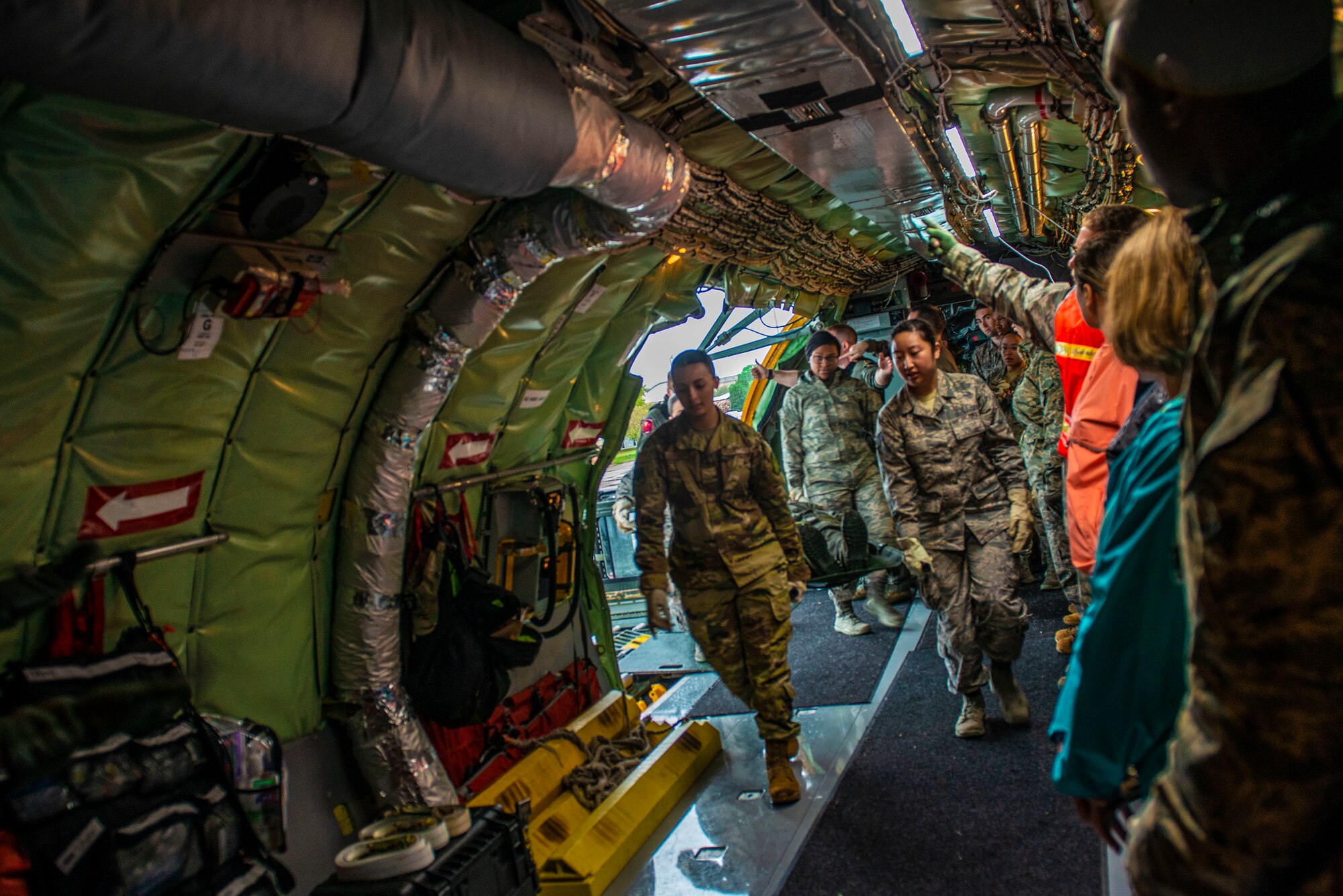 U.S. Airmen from the 20th Medical Group (MDG) carry a simulated patient onto a U.S. Air Force KC-135 Stratotanker during training at Shaw Air Force Base, S.C., April 9, 2019.