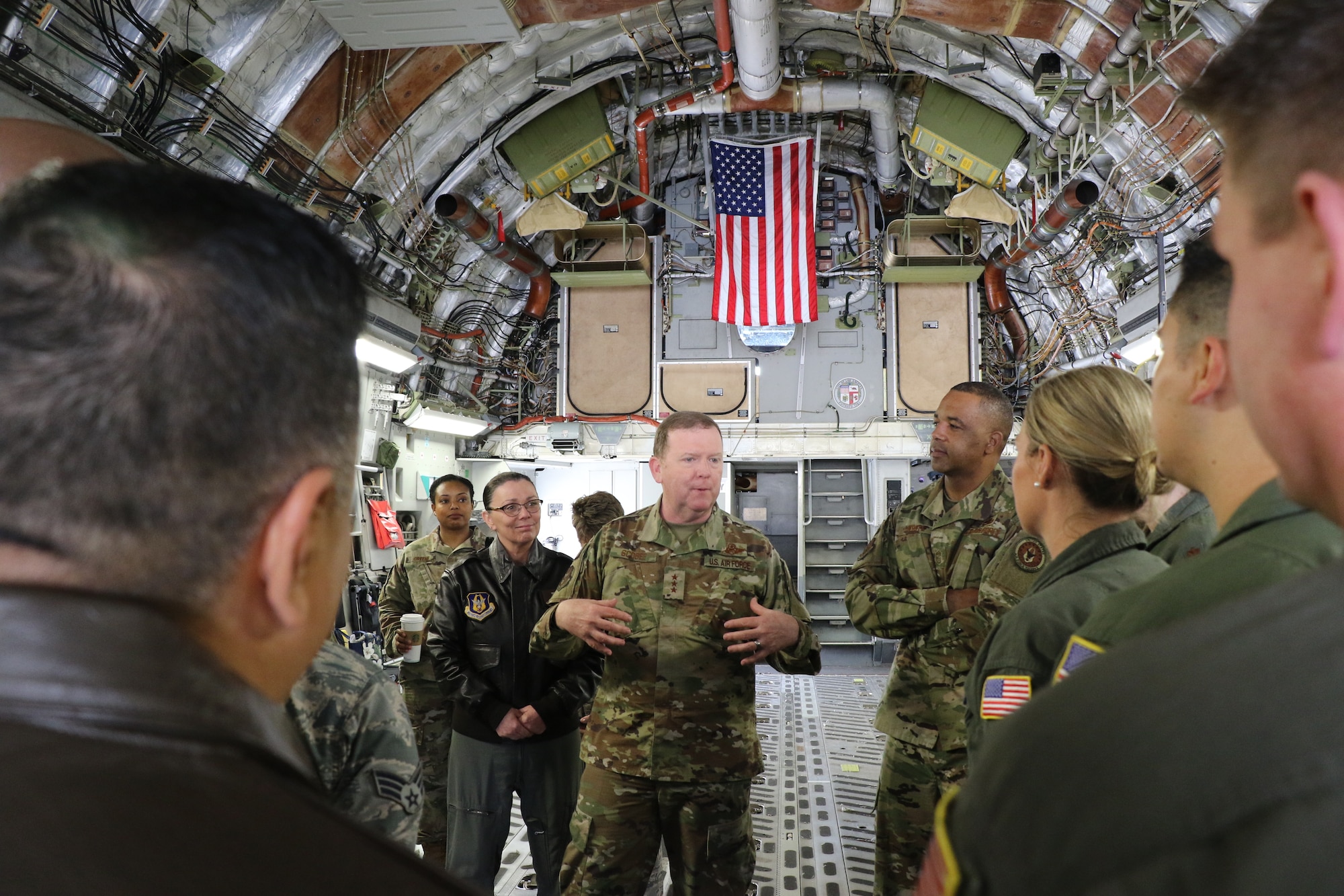 U.S. Air Force Lt. Gen. Richard Scobee, commander of Air Force Reserve Command, and U.S. Air Force Chief Master Sgt. Timothy White, AFRC command chief, speak with members from the 452nd Aeromedical Evacuation Squadron aboard a C-17 Globemaster III on the flight line here April 6, 2019. AFRC senior leadership toured March ARB to learn about the 452nd AMW’s mission, capabilities and challenges as part of a three-day unit visit.
