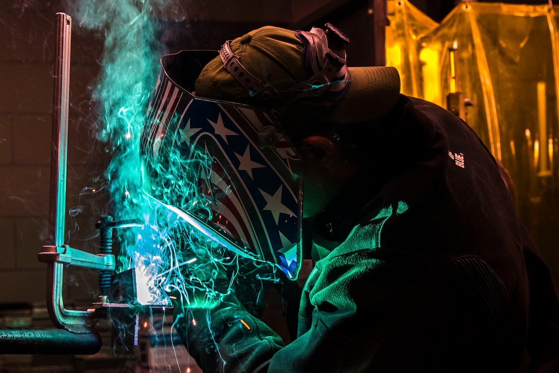 A sailor demonstrates welding techniques.