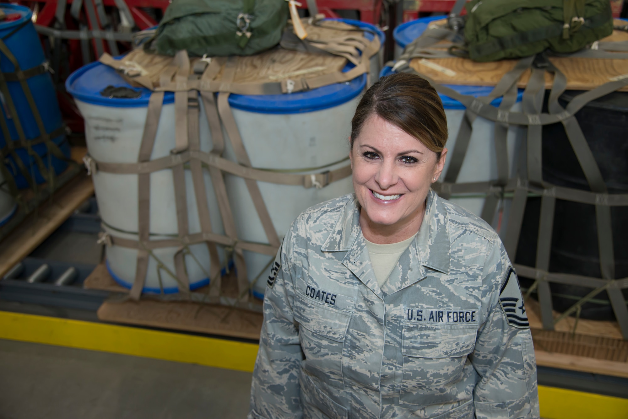 Master Sgt. Kim Coates stands inside the 39th Aerial Port Squadron’s cargo bay downstairs from her office at Peterson Air Force Base, Colorado, March 27, 2019.