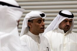 A member of the Kuwait Criminal Investigation Division asks a question regarding operations at the Joint Military Mail Terminal at Camp Arifjan, Kuwait, March 7, 2019.