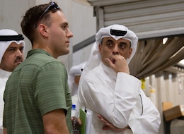 A Soldier from the U.S. Army Criminal Investigation Division asks a question regarding operations at the Joint Military Mail Terminal at Camp Arifjan, Kuwait, March 7, 2019.
