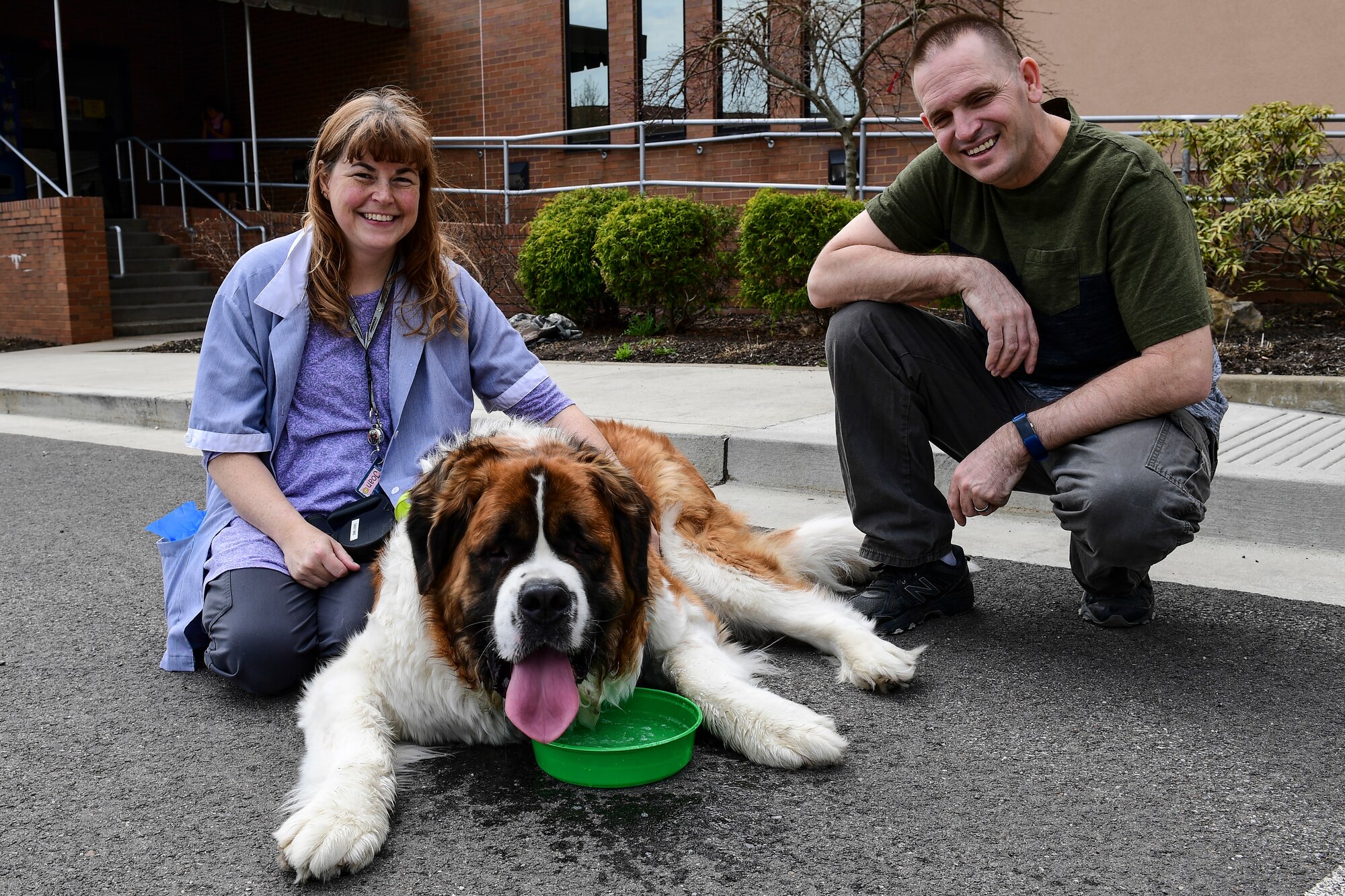 Master Sgt. Thomas McEachern, ramp specialist with the 32nd Aerial Port Squadron, poses for a photo with his wife and their dog at the Pittsburgh International Airport Air Reserve Station, Pennsylvania, April 11, 2019.