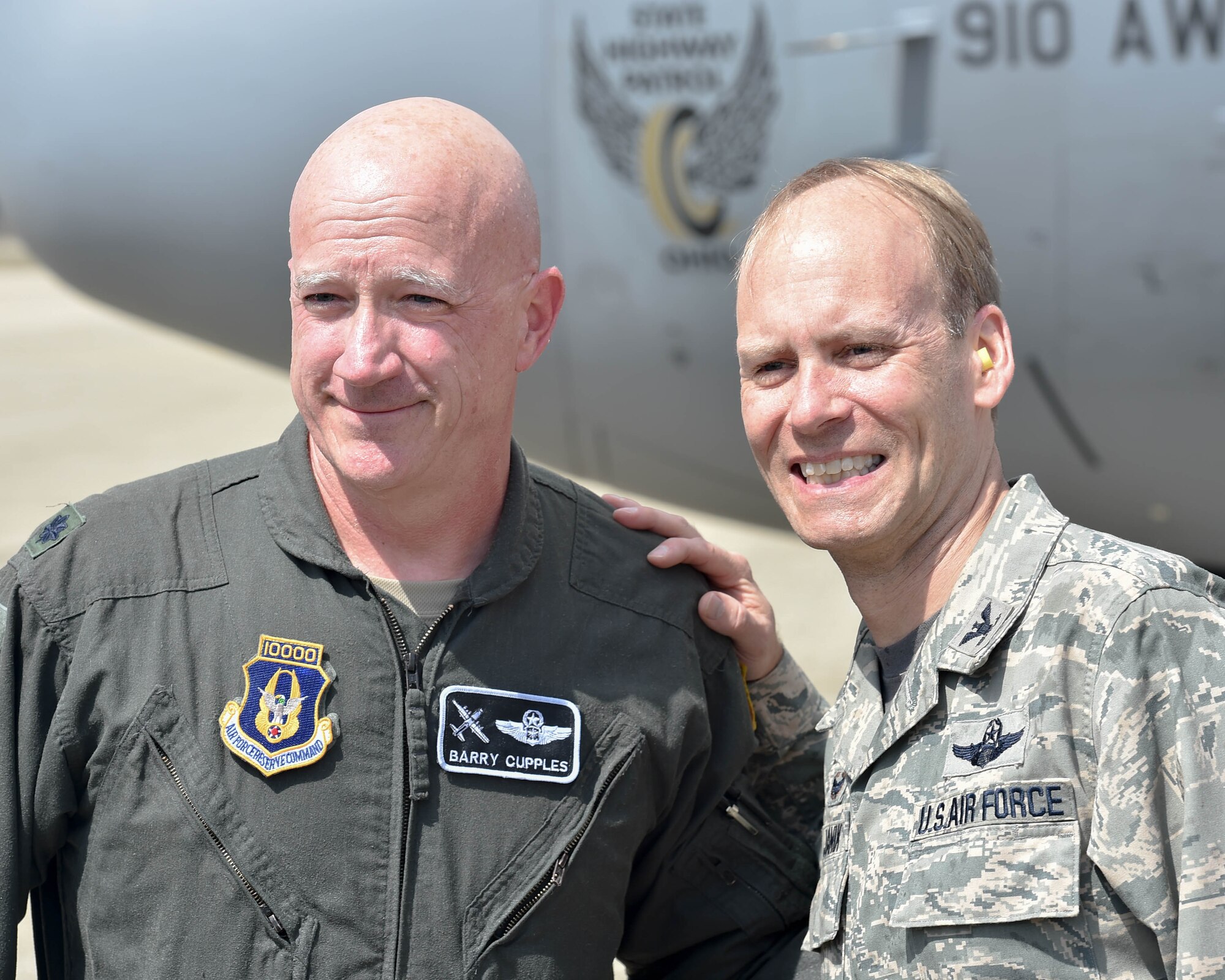 Lt. Col. Barry “JR” Cupples, a navigator assigned to the 757th Airlift Squadron here, poses for a photo with 910th Airlift Wing Commander Col. Joe Janik after completing his ten thousandth C-130 flight hour here, April 6, 2019.