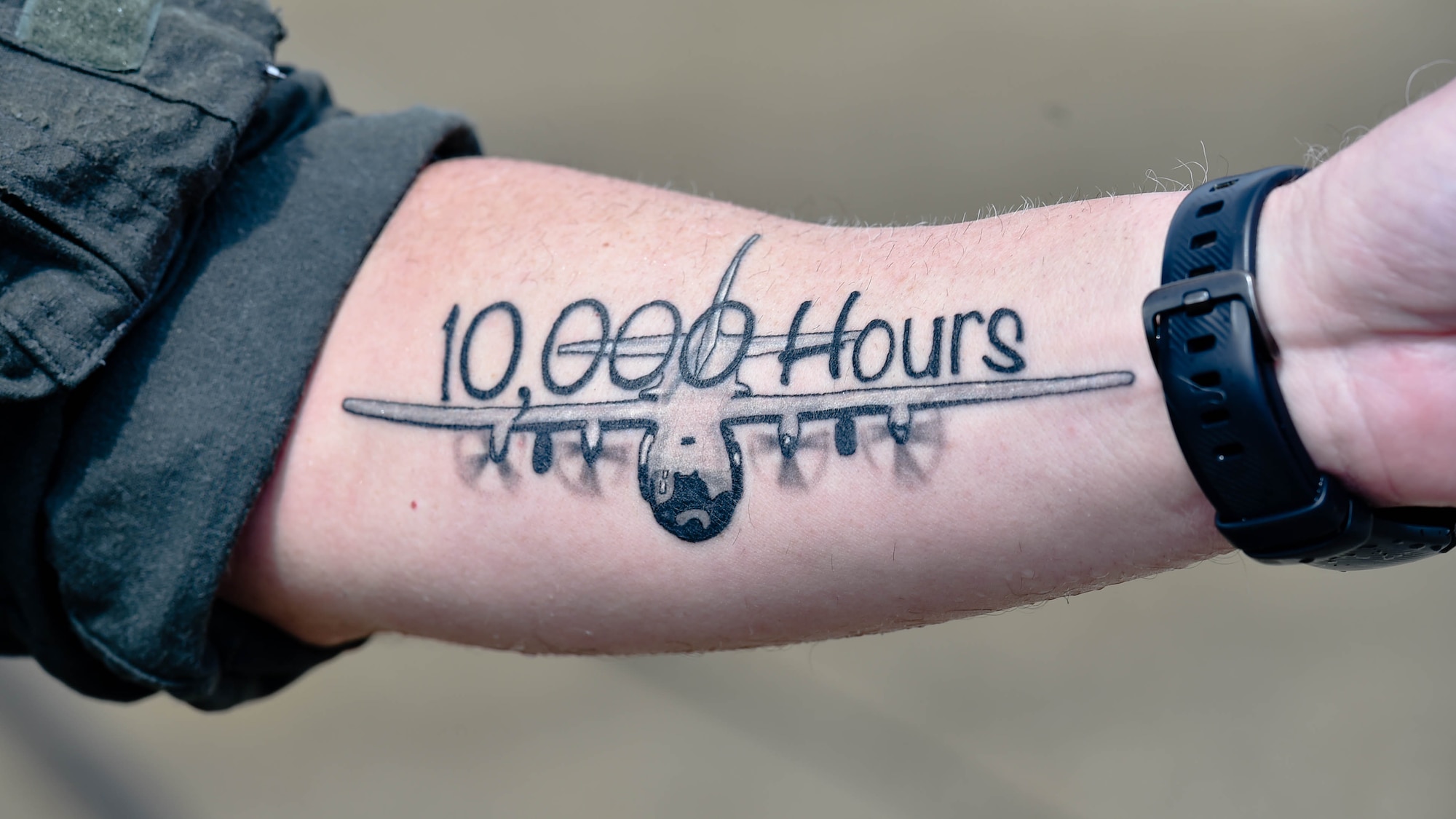 Lt. Col. Barry “JR” Cupples, a navigator assigned to the 757th Airlift Squadron here, displays a new tattoo on his forearm after completing his ten thousandth C-130 flight hour here, April 6, 2019.