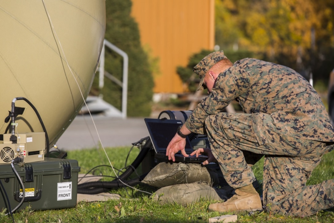 U.S. Marine Corps Lance Cpl. Jeffrey Washburn, with 2nd Radio Battalion, II Marine Expeditionary Force Information Group sets up an Odin’s Sphere in order to have satellite communications during Exercise Trident Juncture 2018 at Vaernes Air Station, Norway, Oct. 12, 2018. Trident Juncture 2018 enhances the U.S. and NATO Allies' and partners' abilities to work together collectively to conduct military operations under challenging conditions. (U.S. Marine Corps photo by Lance Cpl. Tanner Seims)