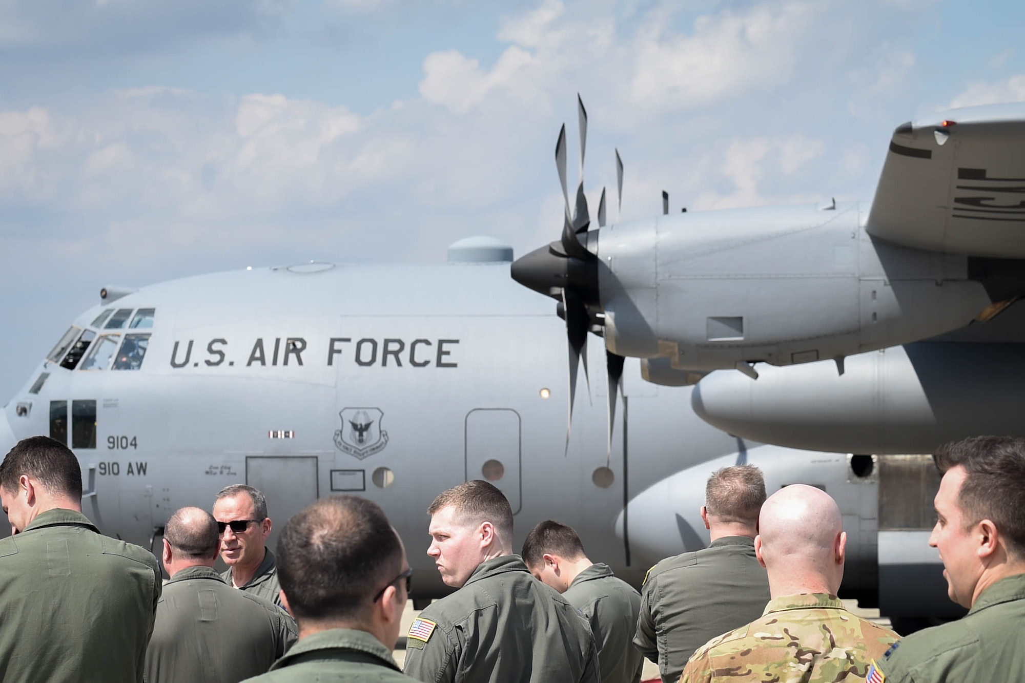 A crowd of aircrew members from the 757th Airlift Squadron wait for Lt. Col. Barry "JR" Cupples, a 757th AS navigator, to step off of a C-130H Hercules aircraft here, April 6, 2019.