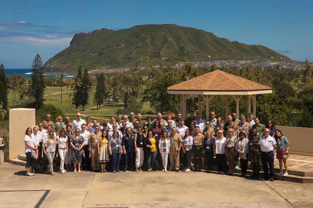 Members of the Foreign Naval Attachés pose for a picture during a tour of Marine Corps Base Hawaii (MCBH), Mar. 21, 2019