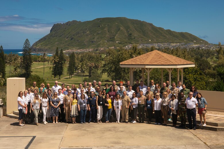 Members of the Foreign Naval Attachés pose for a picture during a tour of Marine Corps Base Hawaii (MCBH), Mar. 21, 2019