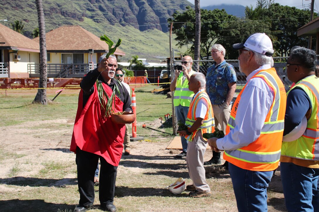 WAIANAE, Hawaii (March 4, 2019) -- Kahu Chris Oliveira of Waianae leads the traditional Hawaiian blessing of the workers and leadership for  the U.S. Army Corps of Engineers'-managed Piilaau Army Recreation Center seawall repair project (PARC). The $4 million project will demolish and replace 700 linear feet of the existing seawall that protects the PARC shoreline along Pokai Bay.  Photo by Dino W. Buchanan, Honolulu District Public Affairs