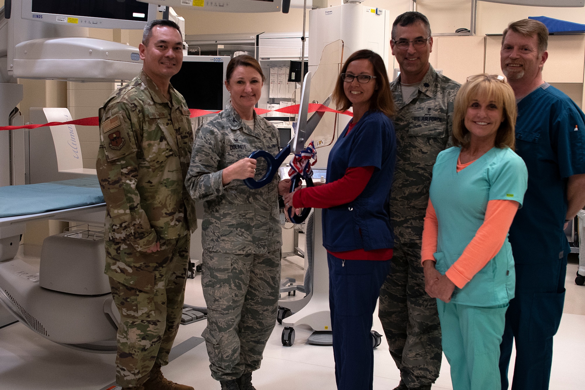 U.S. Air Force Col. Beatrice Dolihite, 81st Medical Group commander, and 81st MDG personnel participate in a ribbon cutting ceremony inside Keesler Medical Center on Keesler Air Force Base, Mississippi, April 10, 2019. The Radiology Oncology Clinic received a Positron Emission Tomography and Computer Tomography scanner as well as an Interventional Radiology Program, which will improve patient care. (U.S. Air Force photo by Senior Airman Suzie Plotnikov)