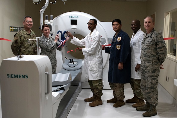 U.S. Air Force Col. Beatrice Dolihite, 81st Medical Group commander, and 81st MDG personnel participate in a ribbon cutting ceremony inside Keesler Medical Center on Keesler Air Force Base, Mississippi, April 10, 2019. The Radiology Oncology Clinic received a Positron Emission Tomography and Computer Tomography scanner as well as an Interventional Radiology Program, which will improve patient care. (U.S. Air Force photo by Senior Airman Suzie Plotnikov)