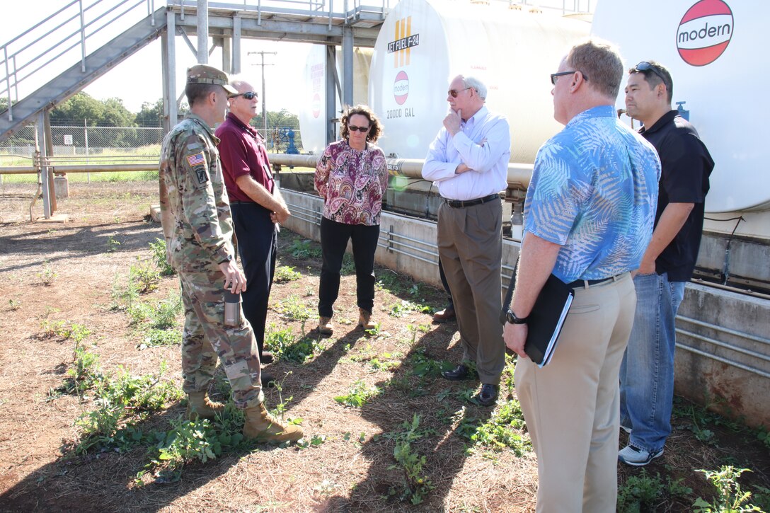 WHEELER ARMY AIRFIELD, Hawaii (Jan. 18, 2019) -- USACE Director of Military Programs Senior Executive Lloyd Caldwell (center right) listens as Todd Barnes, (second from left), Honolulu District's Chief of Engineering & Construction discusses the overall construction layout plans for the Combat Aviation Brigade Phase 1 construction project.