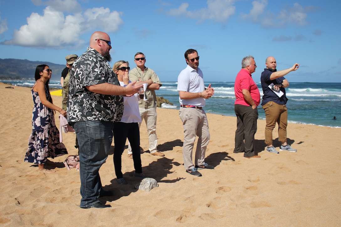 HALEIWA, Hawaii (March 22, 2019) -- Civil Works Project Manager Jason Norris (third from left) explains the purpose of the state constructed stone breakwaters to Mary Frances Repko (center left), staff director, Senate Committee on Environment and Public Works during an overview of two proposed beach replenishment projects adjacent to Haleiwa Small Boat Harbor. Norris also provided insight to proposed sand placement and funding streams for the projects for Repko and other delegates from the Senate Committee on Environment and Public Works and the House Transportation and Infrastructure Committee.