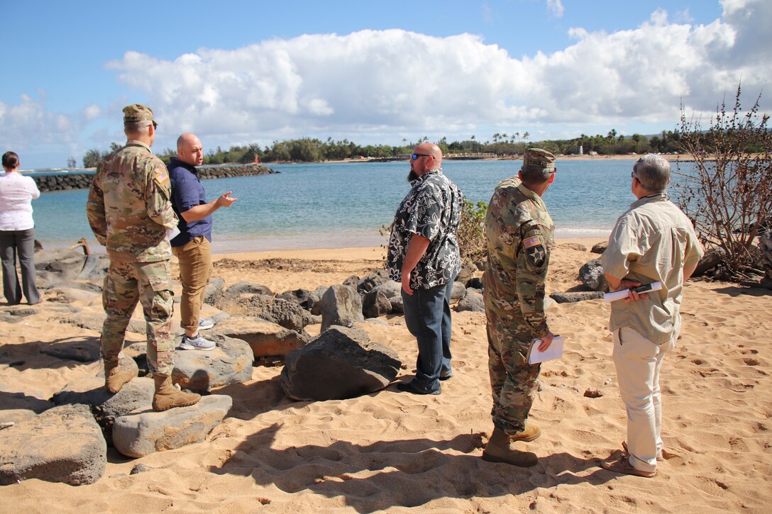 HALEIWA, Hawaii (March 22, 2019) -- John Kane (second from left), Senior PSM (Minority), Senate Committee on Environment and Public Works asks Honolulu District's Project Manager Jason Norris (center) a question about the strength of waves attacking the breakwaters at Haleiwa Small Boat Harbor.  Listening (left) is Pacific Ocean Division Commander Brig. Gen. Thomas Tickner. Kane is part of a group of Congressional Delegates visiting Honolulu District Civil Works and Environmental project sites across Hawaii.