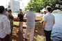 HONOLULU, Hawaii (March 19, 2019) -- Honolulu District's Ala Wai Flood Risk Management project manager Jeff Herzog (second from right) listens to a question about the project from Pacific Ocean Division Commander Brig. Gen. Thomas Tickner (center) during a project area overview at the Ala Wai Canal for staff delegates from the Senate Committee on Environment and Public Works and the House Transportation and Infrastructure Committee.