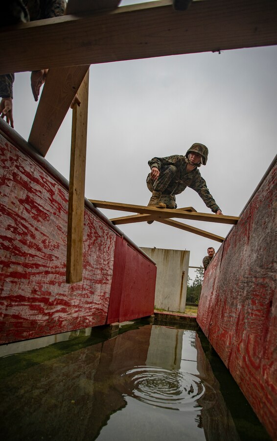 A Naval Reserve Officers Training Corps Midshipmen from Tulane University and Southern University and A&M College, participates in a leadership reaction course at Camp Shelby in Hattiesburg, Miss., April 6, 2019. Marines with Marine Forces Reserve assisted in the LRCs to provide experience and insight for midshipmen to better prepare them for Officer Candidate School and for their future military careers. (U.S. Marine Corps photo by Sgt. Andy O. Martinez)