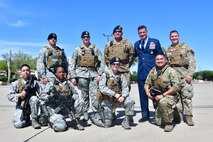 U.S Air Force Col. Mike Drowley, 355th Wing commander, poses for a photo with 355th Security Forces defenders at Davis-Monthan Air Force Base, Ariz., April 11, 2019.