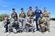 U.S Air Force Col. Mike Drowley, 355th Wing commander, poses for a photo with 355th Security Forces defenders at Davis-Monthan Air Force Base, Ariz., April 11, 2019.