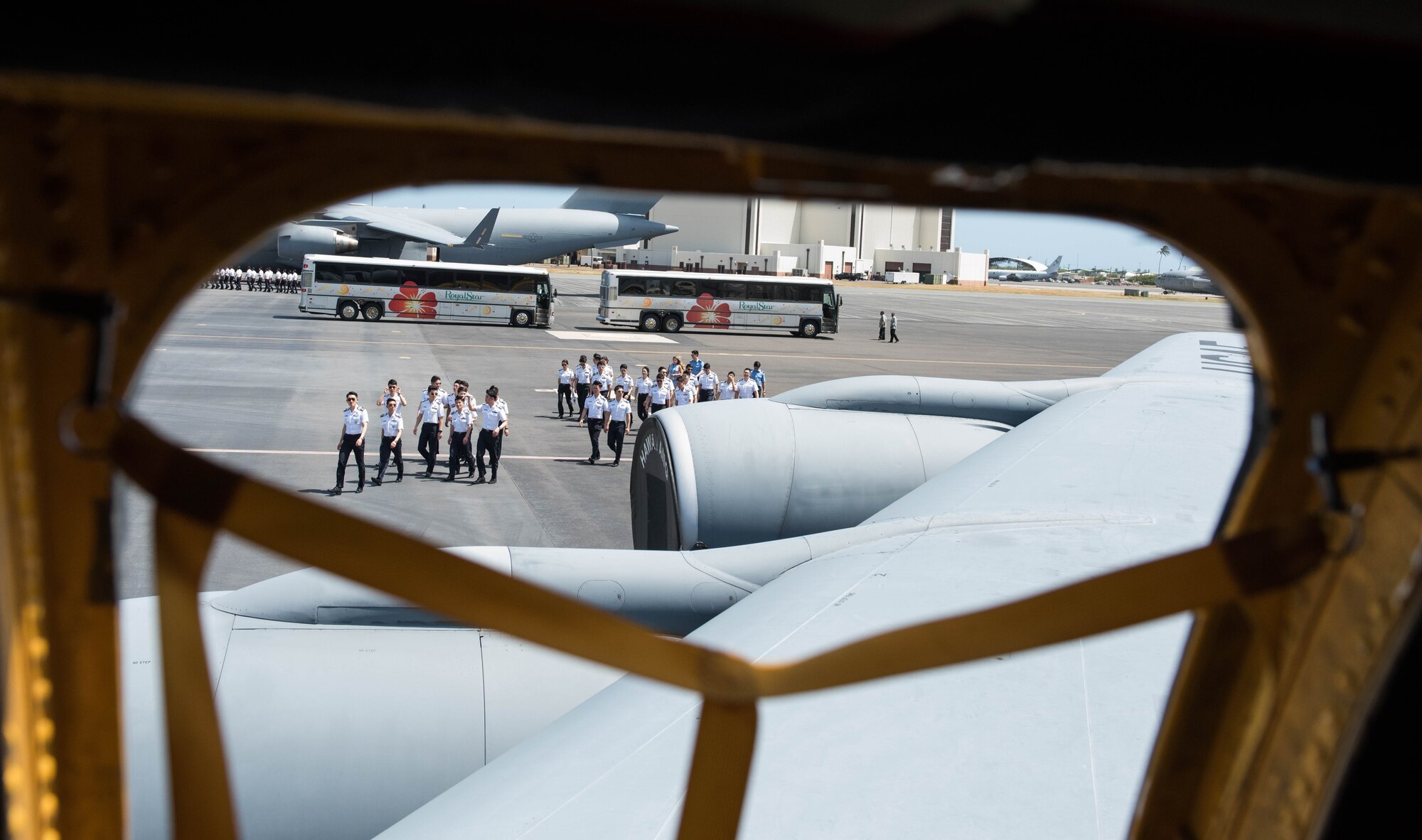 Republic of Korea Air Force academy cadets head toward a United States Hawaii Air National Guard KC-135 Stratotanker for a tour during a visit to Joint Base Pearl Harbor-Hickam, Hawaii, Apr. 2, 2019.