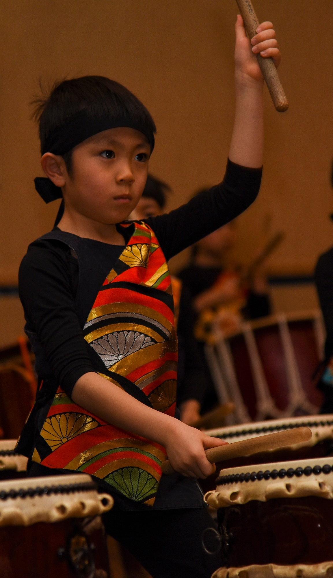 A Makibano Kids drummer plays a taiko drum during the 32nd Annual Japan Day festival at Misawa Air Base, Japan, April 6, 2019. This was one of 16 performance groups that traveled across the Aomori prefecture to attend the Japan Day event. (U.S. Air Force photo by Branden Yamada)