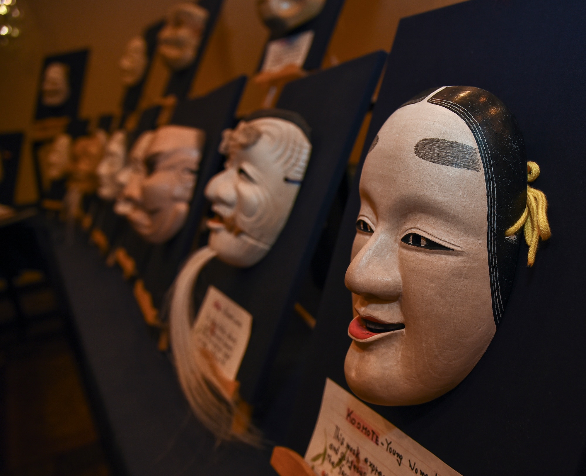 A collection of Noh masks line the entrance to the 32nd Annual Japan Day at Misawa Air Base, Japan, April 6, 2019. Noh masks were traditionally used in Japanese theatre for hundreds of years and have numerous types with different meanings in Japanese culture. (U.S. Air Force photo by Branden Yamada)